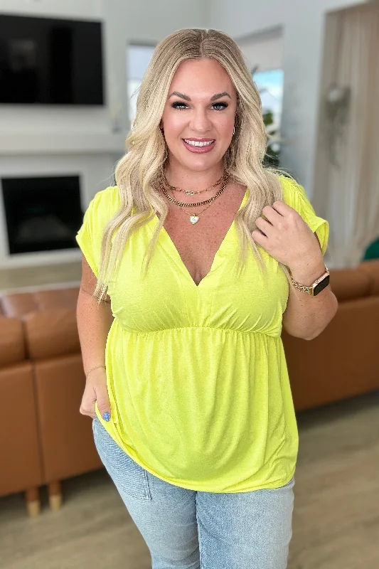 Closeout Deal Rhea Peplum Top in Neon Yellow